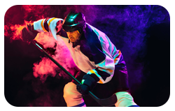 male hockey player with stick ice court dark neon colored wall